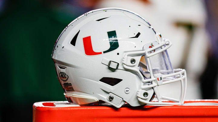 Oct 14, 2023; Chapel Hill, North Carolina, USA; Miami Hurricanes helmet sits on bench as the Hurricanes play against the North Carolina Tar Heels at Kenan Memorial Stadium. Mandatory Credit: Nell Redmond-Imagn Images Oct 14, 2023; Chapel Hill, North Carolina, USA; Miami Hurricanes helmet sits on bench as the Hurricanes play against the North Carolina Tar Heels at Kenan Memorial Stadium. Mandatory Credit: Nell Redmond-Imagn Images
