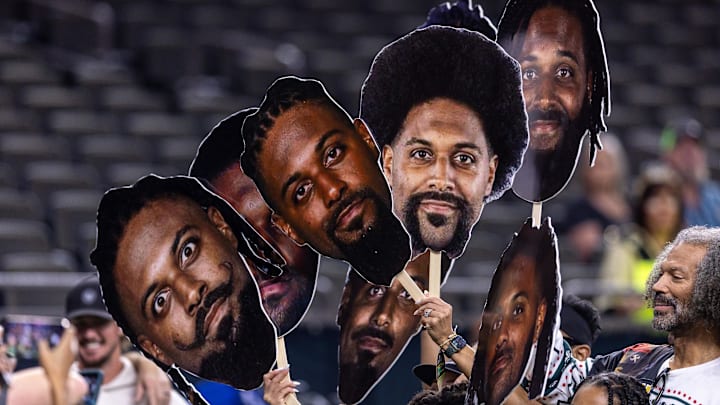 Dec 21, 2025; New Orleans, Louisiana, USA;  New Orleans Saints defensive end Cameron Jordan (94) poses for pictures with his family during warm ups before the game against the New York Jets at Caesars Superdome. Mandatory Credit: Stephen Lew-Imagn Images
