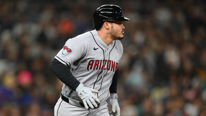 May 29, 2026; Seattle, Washington, USA; Arizona Diamondbacks third baseman Nolan Arenado (28) runs towards first base after hitting single against the Seattle Mariners during the seventh inning at T-Mobile Park. Mandatory Credit: Steven Bisig-Imagn Images