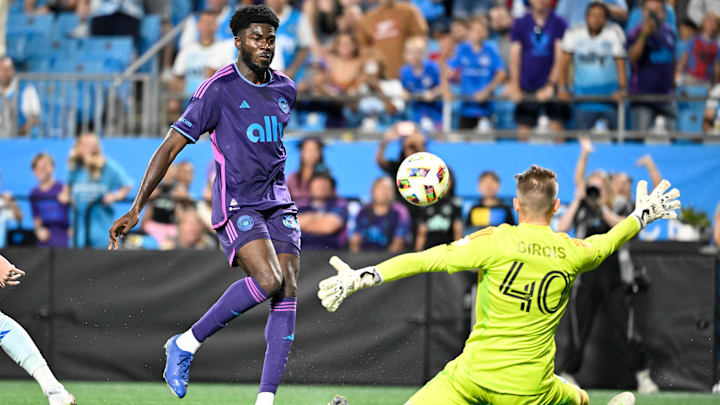 Charlotte FC forward Patrick Agyemang (33) scores as CF Montreal goalkeeper Jonathan Sirois (40) defends in the second half at Bank of America Stadium 