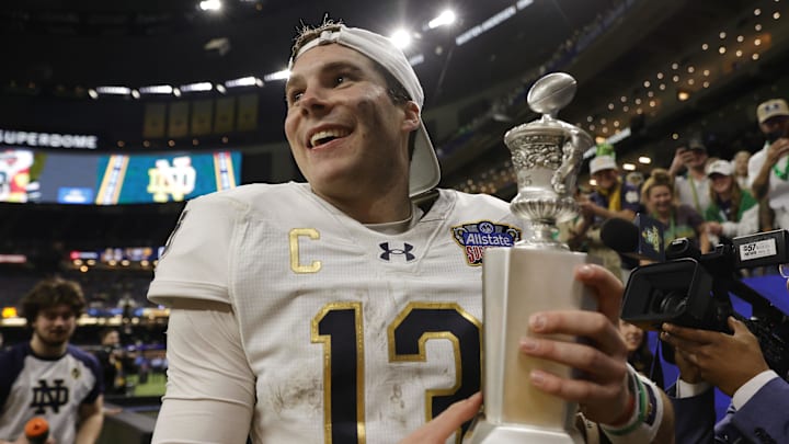 Jan 2, 2025; New Orleans, LA, USA; Notre Dame Fighting Irish quarterback Riley Leonard (13) celebrates with fans in the stands after defeating the Georgia Bulldogs at Caesars Superdome. Mandatory Credit: Amber Searls-Imagn Images