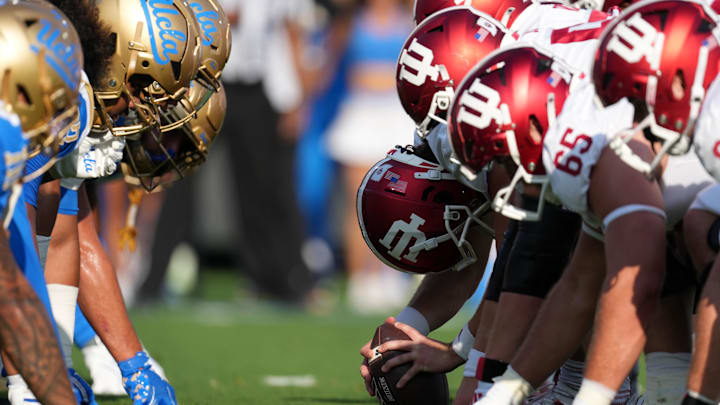 Sep 14, 2024; Pasadena, California, USA; UCLA Bruins and Indiana Hoosiers helmets at the line of scrimmage during the game at Rose Bowl. Mandatory Credit: Kirby Lee-Imagn Images Sep 14, 2024; Pasadena, California, USA; UCLA Bruins and Indiana Hoosiers helmets at the line of scrimmage during the game at Rose Bowl. Mandatory Credit: Kirby Lee-Imagn Images