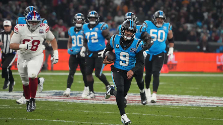 Nov 10, 2024; Munich, Germany; Carolina Panthers quarterback Bryce Young (9) carries the ball on a 24-yard run against the Carolina Panthers  n the second half during the 2024 NFL Munich Game at Allianz Arena. Mandatory Credit: Kirby Lee-Imagn Images
