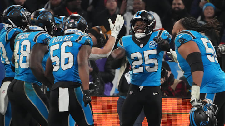 Nov 10, 2024; Munich, Germany; Carolina Panthers safety Xavier Woods (25) celebrates with teammates against the New York Giants in the second half during the 2024 NFL Munich Game at Allianz Arena.