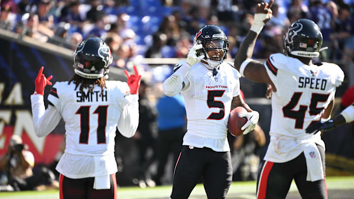 Oct 5, 2025; Baltimore, Maryland, USA; Houston Texans safety Jalen Pitre (5) celebrates a fumble recovery with cornerback Tremon Smith (11) and linebacker E.J. Speed (45) during the fourth quarter against the Baltimore Ravens at M&T Bank Stadium. Mandatory Credit: Rafael Suanes-Imagn Images Oct 5, 2025; Baltimore, Maryland, USA; Houston Texans safety Jalen Pitre (5) celebrates a fumble recovery with cornerback Tremon Smith (11) and linebacker E.J. Speed (45) during the fourth quarter against the Baltimore Ravens at M&T Bank Stadium. Mandatory Credit: Rafael Suanes-Imagn Images