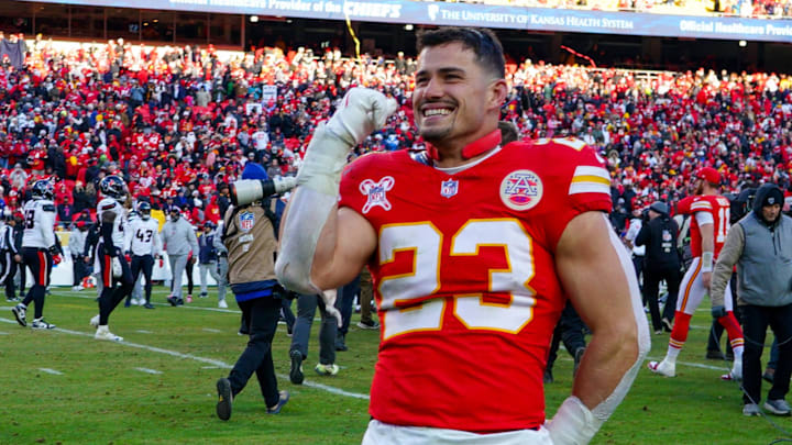 Dec 21, 2024; Kansas City, Missouri, USA; Kansas City Chiefs linebacker Drue Tranquill (23) celebrates after the win over the Houston Texans at GEHA Field at Arrowhead Stadium. 