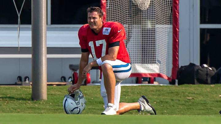 Aug 26, 2020; Indianapolis, Indiana, USA; Indianapolis Colts quarterback Phillip Rivers (17) takes a knee during colts training camp at the Farm Bureau Football Complex. Aug 26, 2020; Indianapolis, Indiana, USA; Indianapolis Colts quarterback Phillip Rivers (17) takes a knee during colts training camp at the Farm Bureau Football Complex.