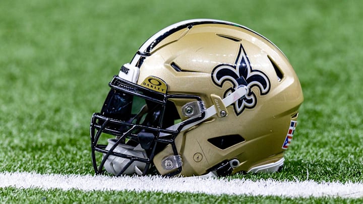 Jan 7, 2024; New Orleans, Louisiana, USA; Detailed view of the New Orleans Saints helmet during warmups against the Atlanta Falcons at Caesars Superdome. Mandatory Credit: Stephen Lew-Imagn Images