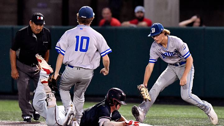 Shallowater runner Brooks Carter dives for the bag as first baseman Sawyer Strosnider runs up too late to tag him out during Game 2 of the 3A Region 1 Final against Brock at Abilene Christian University Friday June 4, 2021. Final score was 7-0, Brock.