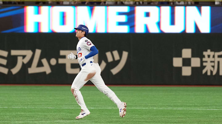  Los Angeles Dodgers designated hitter Shohei Ohtani (17) rounds the bases after hitting a home run against the Yomiuri Giants during the third inning at Tokyo Dome. 