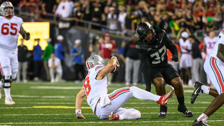 Oct 12, 2024; Eugene, Oregon, USA; Ohio State Buckeyes quarterback Will Howard (18) slides down with no time left to end the game against the Oregon Ducks at Autzen Stadium.