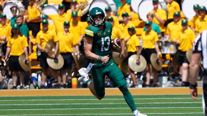 Sep 13, 2025; Waco, Texas, USA;  Baylor Bears quarterback Sawyer Robertson (13) carries the ball for a first down against the Samford Bulldogs during the second half at McLane Stadium. Mandatory Credit: Chris Jones-Imagn Images