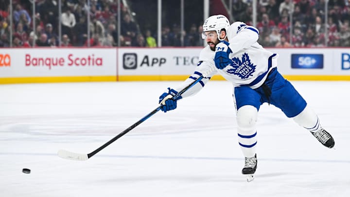 Jan 18, 2025; Montreal, Quebec, CAN; Toronto Maple Leafs defenseman Conor Timmins (25) shoots the puck against the Montreal Canadiens during the first period at Bell Centre. Mandatory Credit: David Kirouac-Imagn Images