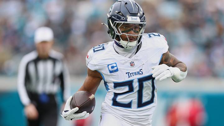 Jan 4, 2026; Jacksonville, Florida, USA; Tennessee Titans running back Tony Pollard (20) runs the ball against the Jacksonville Jaguars during the first quarter at EverBank Stadium. Mandatory Credit: Morgan Tencza-Imagn Images