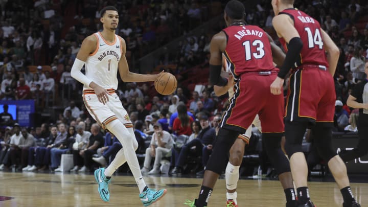 Feb 7, 2024; Miami, Florida, USA; San Antonio Spurs center Victor Wembanyama (1) dribbles the basketball against the Miami Heat during the third quarter at Kaseya Center. 
