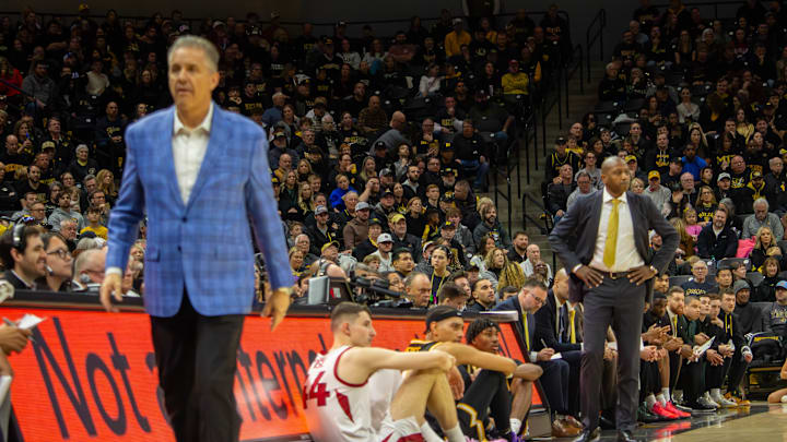 Jan. 18 2025; Columbia, Missouri, USA; Missouri Tigers head coach Dennis Gates and Arkansas Razorbacks head coach John Calipari walk on the sideline during a game a game at Mizzou Arena. 