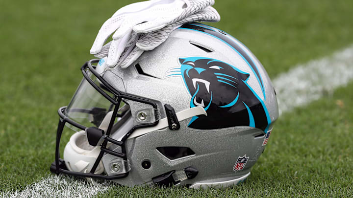 Jul 27, 2017; Spartanburg, SC, USA; Carolina Panthers logo helmet and gloves wait on the turf during Panthers Training Camp at Wofford College. Mandatory Credit: Jim Dedmon-Imagn Images