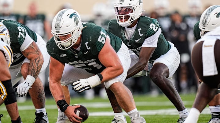 Michigan State quarterback Aidan Chiles (2) calls for a snap from offensive lineman Matt Gulbin (51) against Western Michigan during the first half at Spartan Stadium in East Lansing on Friday, August 29, 2025.
