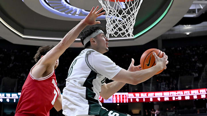 Michigan State is a small favorite against Wisconsin in the Big Ten semifinal.