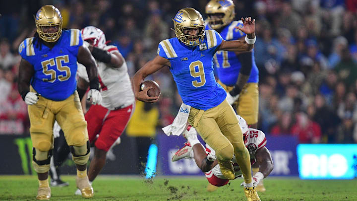 UCLA quarterback Nico Iamaleava (9) takes off running against Nebraska.