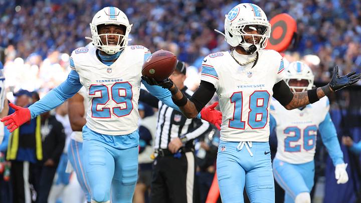 Oct 18, 2026; Indianapolis, Indiana, USA; Tennessee Titans cornerback Cor'Dale Flott (18) reacts with safety Tony Adams (29) after catching an interception against the Indianapolis Colts during the second half at Lucas Oil Stadium. Mandatory Credit: Trevor Ruszkowski-Imagn Images Oct 18, 2026; Indianapolis, Indiana, USA; Tennessee Titans cornerback Cor'Dale Flott (18) reacts with safety Tony Adams (29) after catching an interception against the Indianapolis Colts during the second half at Lucas Oil Stadium. Mandatory Credit: Trevor Ruszkowski-Imagn Images