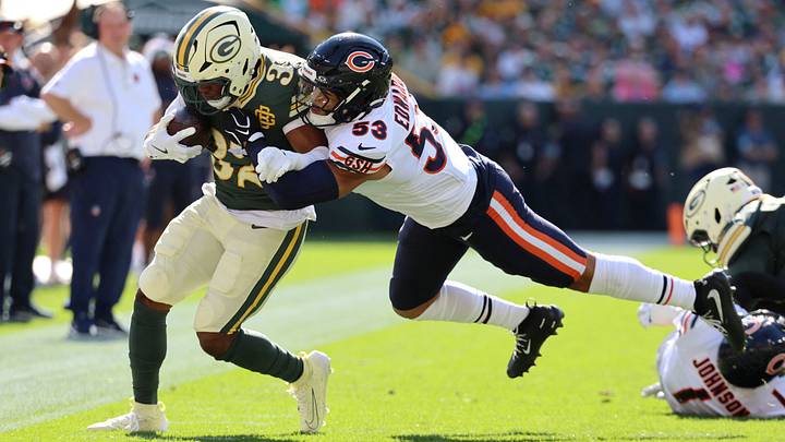 Oct 11, 2026; Green Bay, Wisconsin, USA; Chicago Bears linebacker T.J. Edwards (53) forces Green Bay Packers running back MarShawn Lloyd (32) out of bounds during the first quarter at Lambeau Field. Mandatory Credit: Mike Dinovo-Imagn Images Oct 11, 2026; Green Bay, Wisconsin, USA; Chicago Bears linebacker T.J. Edwards (53) forces Green Bay Packers running back MarShawn Lloyd (32) out of bounds during the first quarter at Lambeau Field. Mandatory Credit: Mike Dinovo-Imagn Images