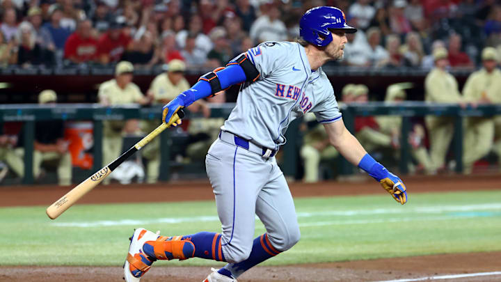 Aug 27, 2024; Phoenix, Arizona, USA; New York Mets infielder Jeff McNeil drives in a run in the second inning against the Arizona Diamondbacks at Chase Field. Mandatory Credit: Mark J. Rebilas-Imagn Images