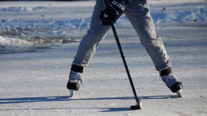 Kids Play Hockey On A Frozen Pond