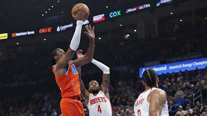 Nov 8, 2024; Oklahoma City, Oklahoma, USA; Oklahoma City Thunder forward Jalen Williams (8) shoots beside Houston Rockets guard Jalen Green (4) during the first quarter at Paycom Center. Mandatory Credit: Alonzo Adams-Imagn Images
