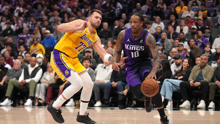 Jan 12, 2026; Sacramento, California, USA; Sacramento Kings guard DeMar DeRozan (10) dribbles past Los Angeles Lakers guard Luka Doncic (77) in the third quarter at the Golden 1 Center. Jan 12, 2026; Sacramento, California, USA; Sacramento Kings guard DeMar DeRozan (10) dribbles past Los Angeles Lakers guard Luka Doncic (77) in the third quarter at the Golden 1 Center.