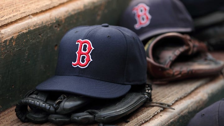 Aug 23, 2011; Arlington, TX, USA; Hats and gloves from the Boston Red Sox team near the edge of the dugout before the game against the Texas Rangers at Rangers Ballpark.  Mandatory Credit: Kevin Jairaj-Imagn Images
