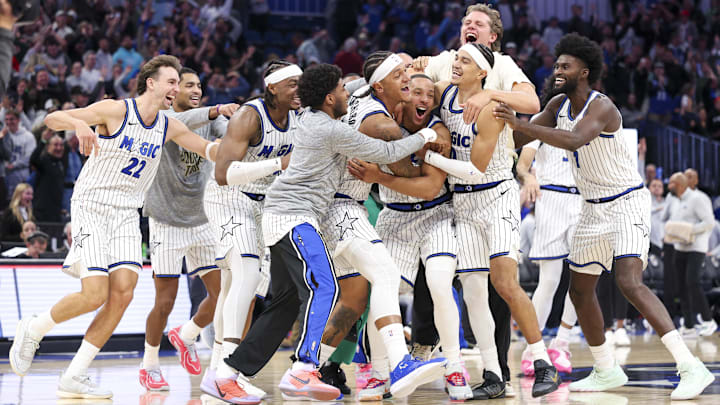 Orlando Magic guard Desmond Bane gets mobbed by teammates after the fourth game-winning 3-pointer in franchise history helped avoid overtime in a potentially season-altering win over the Portland Trail Blazers.