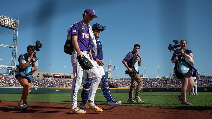 Jun 21, 2025; Omaha, Neb, USA; LSU Tigers starting pitcher Kade Anderson (32) and catcher Luis Hernandez (23) walk to the dugout before the game against the Coastal Carolina Chanticleers at Charles Schwab Field. Mandatory Credit: Steven Branscombe-Imagn Images Jun 21, 2025; Omaha, Neb, USA; LSU Tigers starting pitcher Kade Anderson (32) and catcher Luis Hernandez (23) walk to the dugout before the game against the Coastal Carolina Chanticleers at Charles Schwab Field. Mandatory Credit: Steven Branscombe-Imagn Images