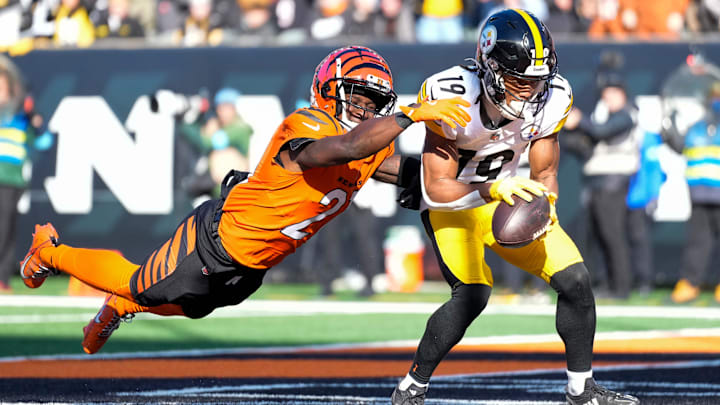 Pittsburgh Steelers wide receiver Calvin Austin III (19) catches a touchdown pass under coverage from Cincinnati Bengals cornerback Mike Hilton (21) in the second quarter of the NFL Week 13 game between the Cincinnati Bengals and the Pittsburgh Steelers at Paycor Stadium in downtown Cincinnati on Sunday, Dec. 1, 2024.