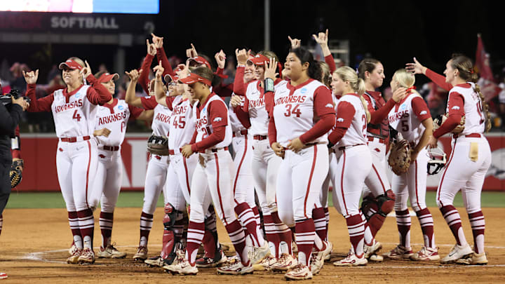 May 18, 2025; Fayetteville, AR, USA; Arkansas Razorbacks players celebrate after the end of the game against the Oklahoma State Cowgirls at Bogle Park. Mandatory Credit: Nelson Chenault-Imagn Images