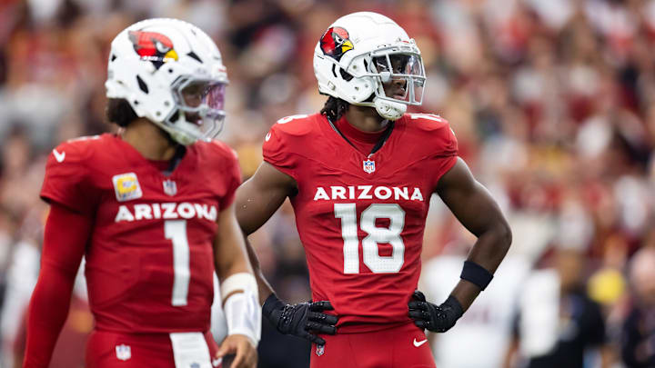 Sep 29, 2024; Glendale, Arizona, USA; Arizona Cardinals wide receiver Marvin Harrison Jr. (18) alongside quarterback Kyler Murray (1) against the Washington Commanders in the first half at State Farm Stadium. Mandatory Credit: Mark J. Rebilas-Imagn Images Sep 29, 2024; Glendale, Arizona, USA; Arizona Cardinals wide receiver Marvin Harrison Jr. (18) alongside quarterback Kyler Murray (1) against the Washington Commanders in the first half at State Farm Stadium. Mandatory Credit: Mark J. Rebilas-Imagn Images