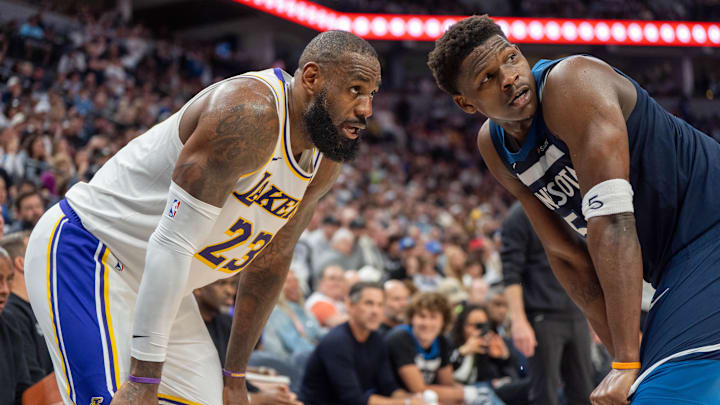 Apr 27, 2025; Minneapolis, Minnesota, USA; Minnesota Timberwolves guard Anthony Edwards (5) guards Los Angeles Lakers forward LeBron James (23) in the second quarter during game four of first round for the 2025 NBA Playoffs at Target Center. Mandatory Credit: Matt Blewett-Imagn Images