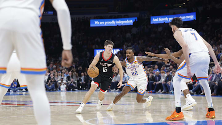 Mar 3, 2025; Oklahoma City, Oklahoma, USA; Houston Rockets guard Reed Sheppard (15) moves the ball down the court beside Oklahoma City Thunder guard Cason Wallace (22) during the second half at Paycom Center. Mandatory Credit: Alonzo Adams-Imagn Images