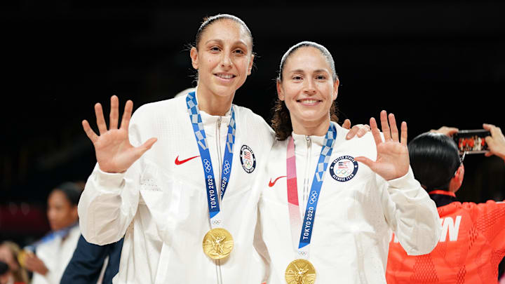 Aug 8, 2021; Saitama, Japan; United States players Diana Taurasi and Sue Bird celebrate with their gold medals after the women's basketball gold medal match during the Tokyo 2020 Olympic Summer Games at Saitama Super Arena. Mandatory Credit: James Lang-Imagn Images