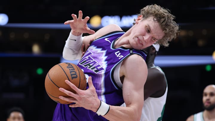 Dec 30, 2025; Salt Lake City, Utah, USA; Utah Jazz forward Lauri Markkanen (23) fights for a rebound during the second half against the Boston Celtics at Delta Center. Mandatory Credit: Rob Gray-Imagn Images