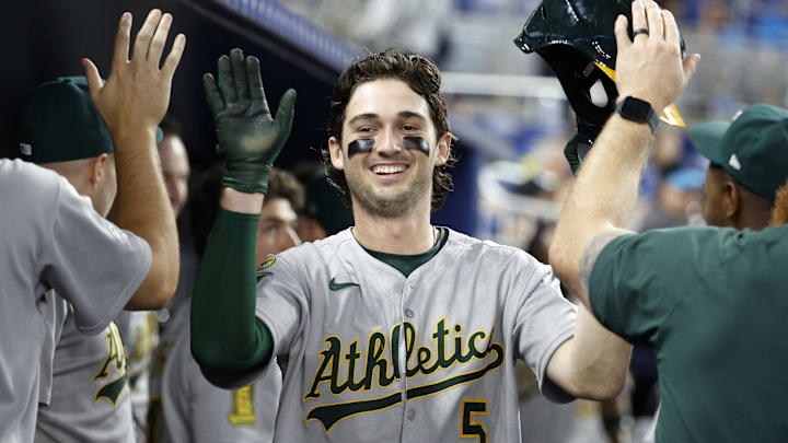 May 4, 2025; Miami, Florida, USA; Oakland Athletics shortstop Jacob Wilson (5) is greeted in the dugout by teammates after scoring against the Miami Marlins during the second inning at loanDepot Park. Mandatory Credit: Rhona Wise-Imagn Images May 4, 2025; Miami, Florida, USA; Oakland Athletics shortstop Jacob Wilson (5) is greeted in the dugout by teammates after scoring against the Miami Marlins during the second inning at loanDepot Park. Mandatory Credit: Rhona Wise-Imagn Images