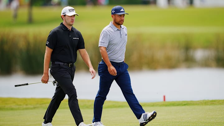 Apr 21, 2023; Avondale, Louisiana, USA; Patrick Cantlay and Xander Schauffele walk the ninth green