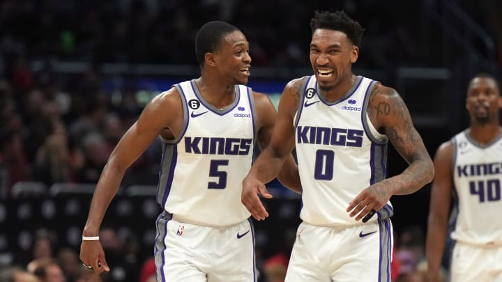 Feb 24, 2023; Los Angeles, California, USA; Sacramento Kings guard De'Aaron Fox (5) and guard Malik Monk (0) celebrate against the LA Clippers in the second half at Crypto.com Arena. The Kings defeated the Clippers 176-175 in double overtime. Mandatory Credit: Kirby Lee-USA TODAY Sports