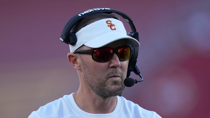 Oct 21, 2023; Los Angeles, California, USA; Southern California Trojans head coach Lincoln Riley watches from the sidelines against the Utah Utes in the first half at United Airlines Field at Los Angeles Memorial Coliseum. Mandatory Credit: Kirby Lee-Imagn Images