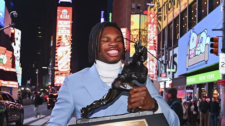 Travis Hunter with the Heisman Trophy on Dec. 14, 2024.
