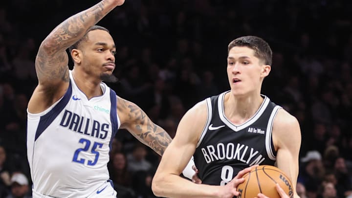 Feb 24, 2026; Brooklyn, New York, USA;  Brooklyn Nets guard Egor Demin (8) drives past Dallas Mavericks forward P.J. Washington (25) in the first quarter at Barclays Center. Mandatory Credit: Wendell Cruz-Imagn Images