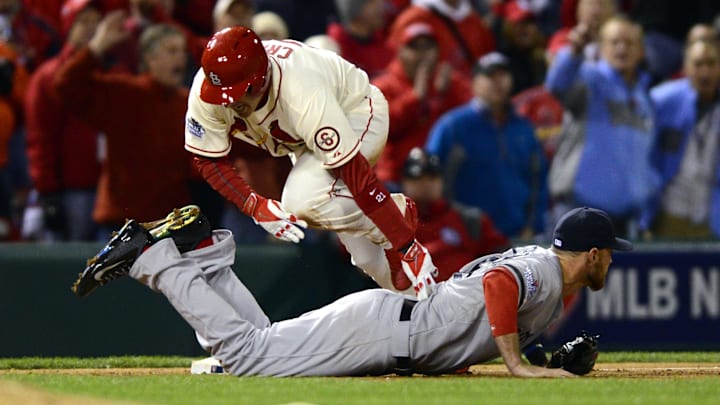 Oct 26, 2013; St. Louis, MO, USA; St. Louis Cardinals designated hitter Allen Craig (21) is tripped by Boston Red Sox third baseman Will Middlebrooks (16) during the ninth inning and would score on an obstruction call to win game three of the MLB baseball World Series at Busch Stadium. Cardinals won 5-4. Mandatory Credit: Jeff Curry-Imagn Images Oct 26, 2013; St. Louis, MO, USA; St. Louis Cardinals designated hitter Allen Craig (21) is tripped by Boston Red Sox third baseman Will Middlebrooks (16) during the ninth inning and would score on an obstruction call to win game three of the MLB baseball World Series at Busch Stadium. Cardinals won 5-4. Mandatory Credit: Jeff Curry-Imagn Images