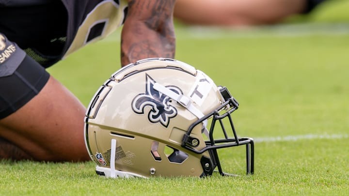 Jun 10, 2025; New Orleans, LA, USA; Detailed view of the Saints helmet during minicamp at Ochsner Sports Performance Center. Mandatory Credit: Stephen Lew-Imagn Images Jun 10, 2025; New Orleans, LA, USA; Detailed view of the Saints helmet during minicamp at Ochsner Sports Performance Center. Mandatory Credit: Stephen Lew-Imagn Images