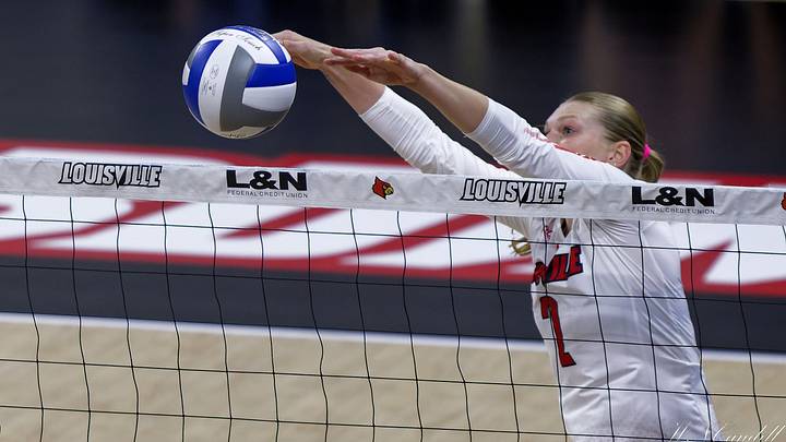 Chloe Meester with a solo block at the net. Chloe Meester with a solo block at the net.