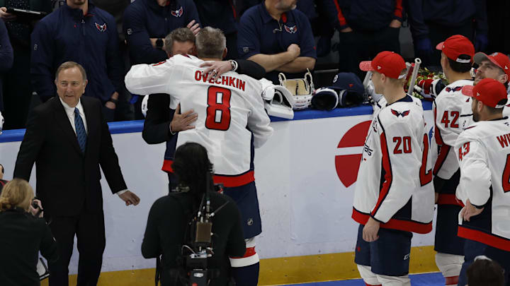 Apr 6, 2025; Elmont, New York, USA;  former Canadian-American ice hockey player Wayne Gretzky and Comissioner of the NHL Gary Bettman congratulates Washington Capitals left wing Alex Ovechkin (8) after scoring a goal in the 2nd period against the New York Islanders at UBS Arena. The goal is the 895th of Ovechkin’s career, breaking the NHL all-time career goals record previously held by Wayne Gretzky.at UBS Arena. 